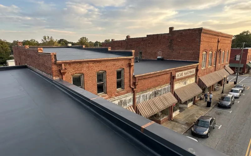 Downtown small town commercial building flat roof repair in Commerce Georgia